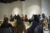 A group of people sit in a circle.