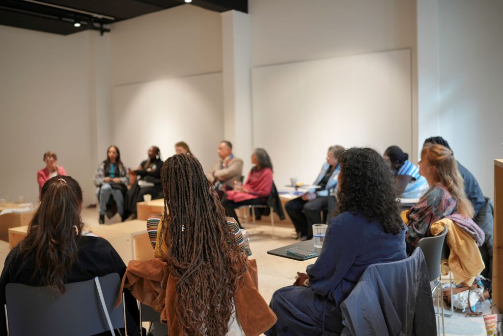 A group of people sat in a circle.